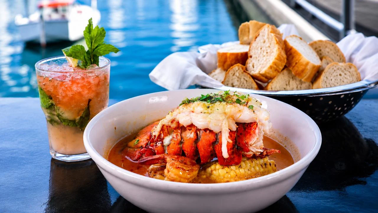 Killer Shrimp lobster and shrimp sauce bowl with marina view at Killer Shrimp Marina del Rey